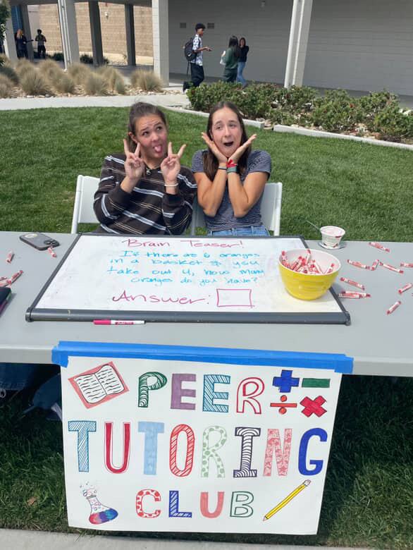 Maggie Appel and Abby Tuller Representing Peer Tutoring Club At Club Rush 2025.