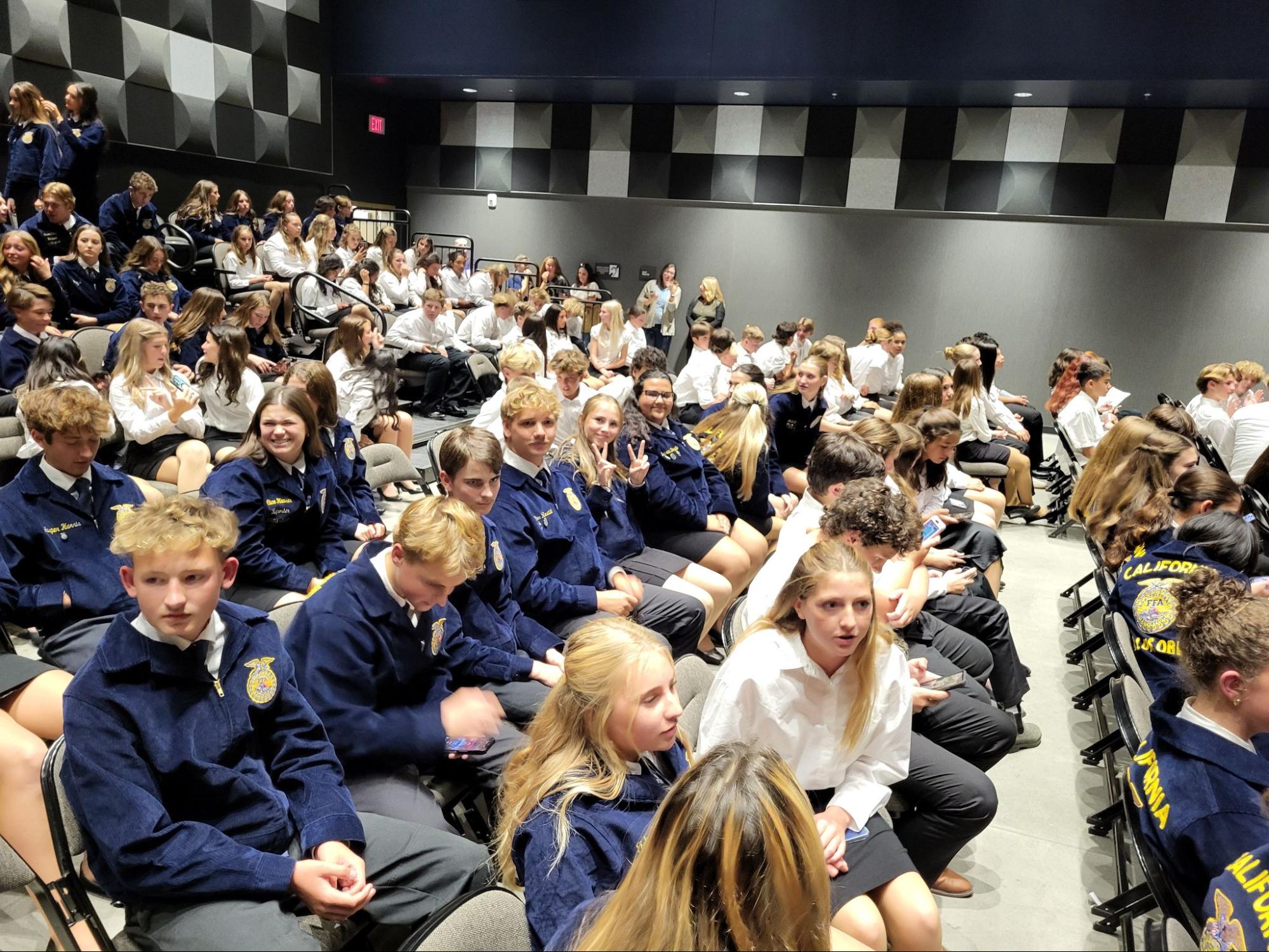Students sit during an FFA opening and closing ceremony. 
