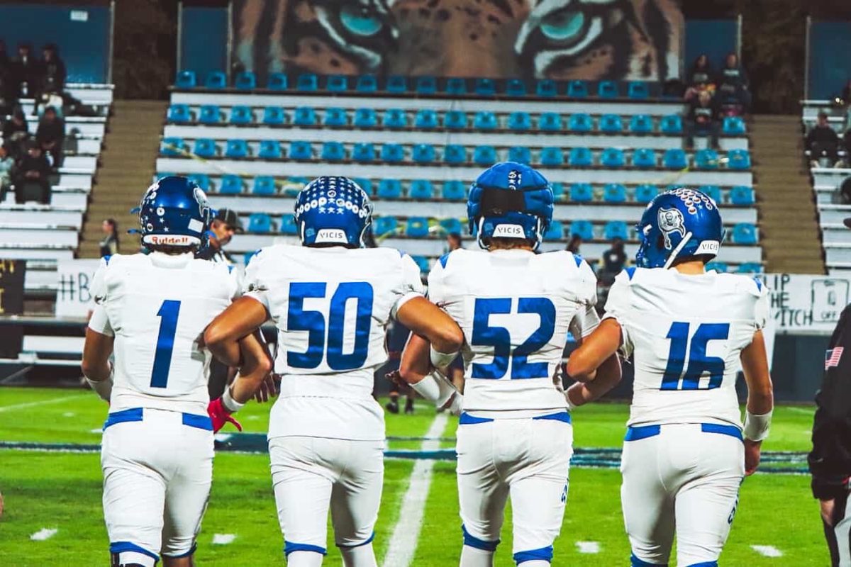 Luca Macari (Far Left), #50 Radden Batalla (Middle Left), #52 Colton Rosenlieb (Middle Right), and #16 Sands Dougherty (Far Right) walk out together to center field for coin toss before the game begins.