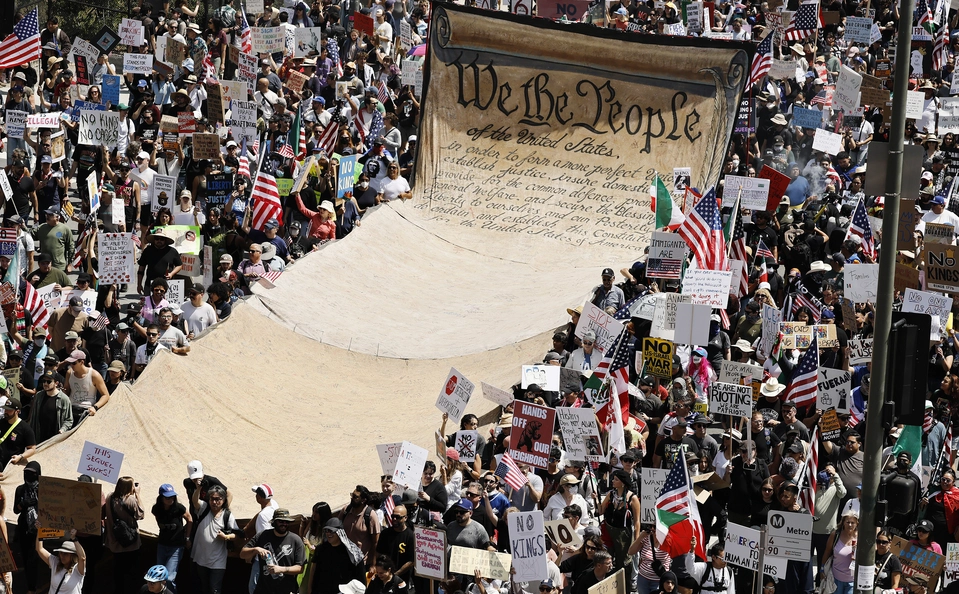 Protesters carry a banner of the U.S. Constitution in downtown Los Angeles on "No Kings Day" June 14, 2025. 