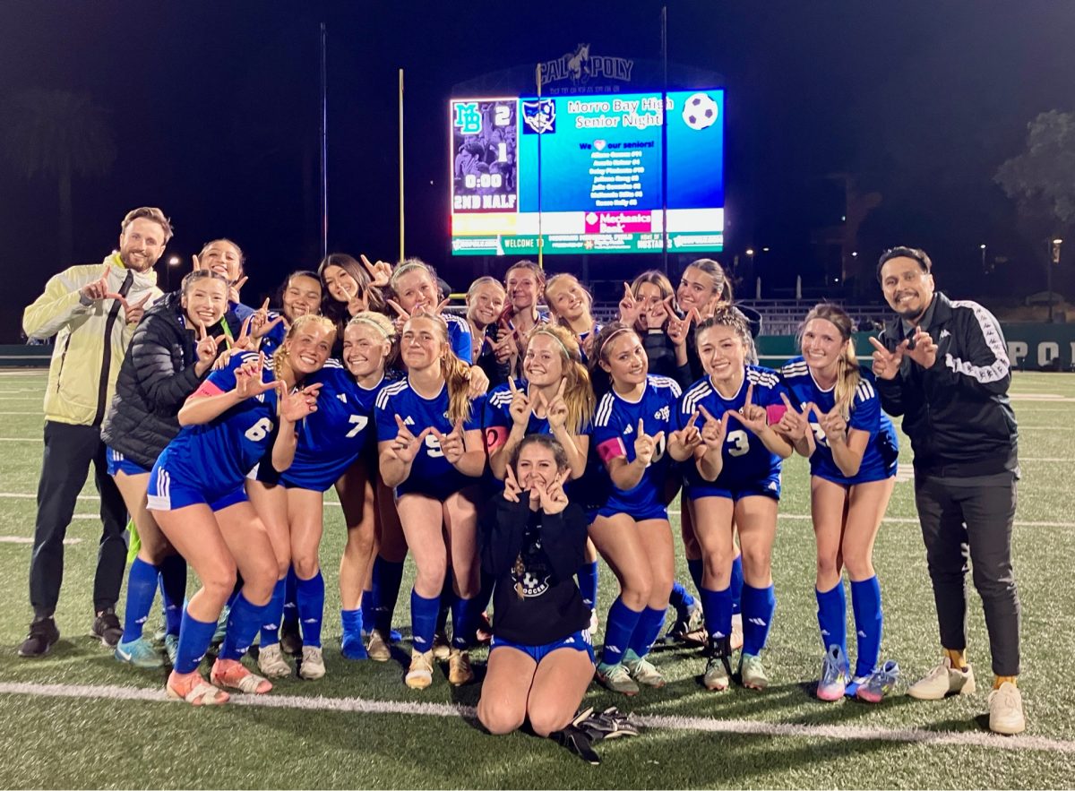 Girls' soccer poses for their win.
