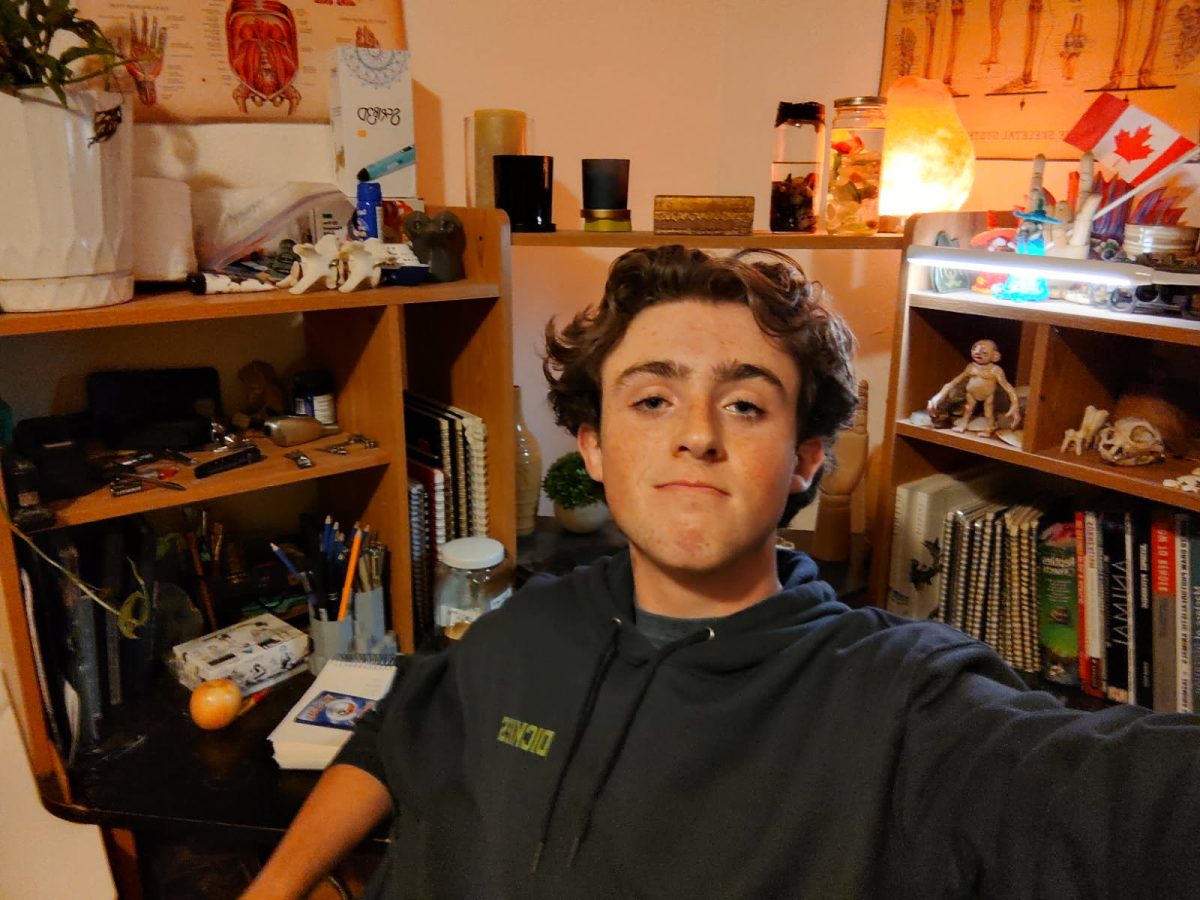 Parks posing in front of desk (Photo Credit: Dexter Parks)
