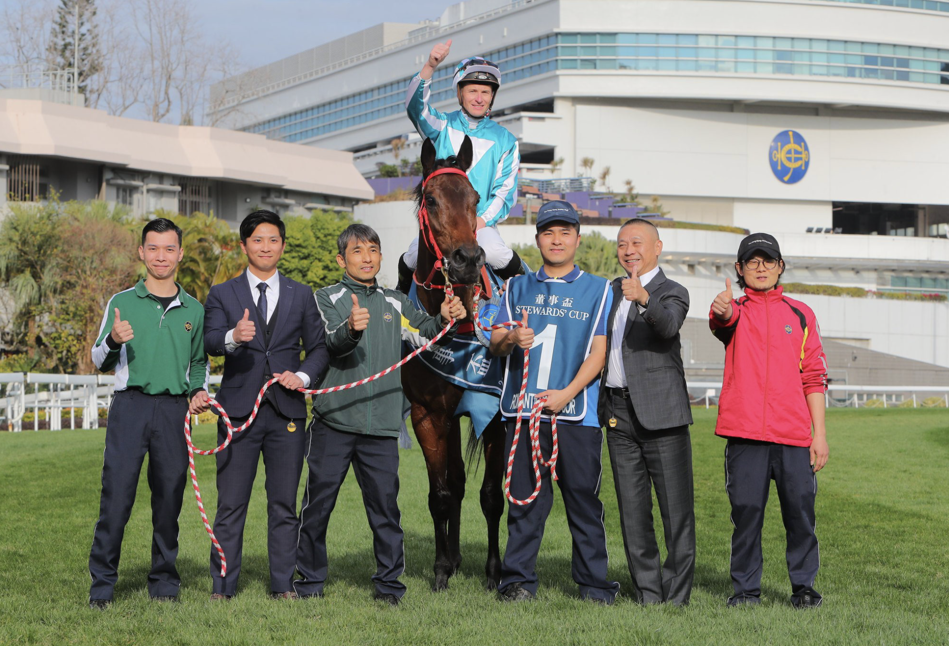Romantic Warrior and some members of his team pose for an official photo after his Stewards’ Cup victory. (Source: The Hong Kong Jockey Club)