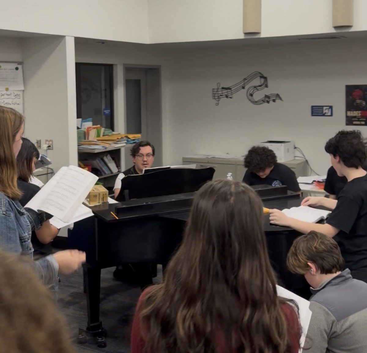 Cast of Mamma Mia! rehearsing their music. 