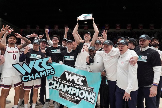 SMC players and coaches hold up the WCC champion trophy after their big win over Gonzaga (Source: Saint Mary’s College of California)