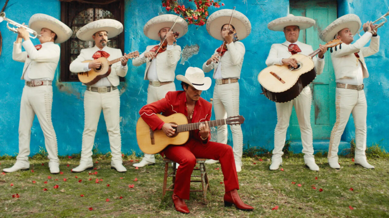 Bruno Mars plays the guitar in his "Risk It All" music video. 