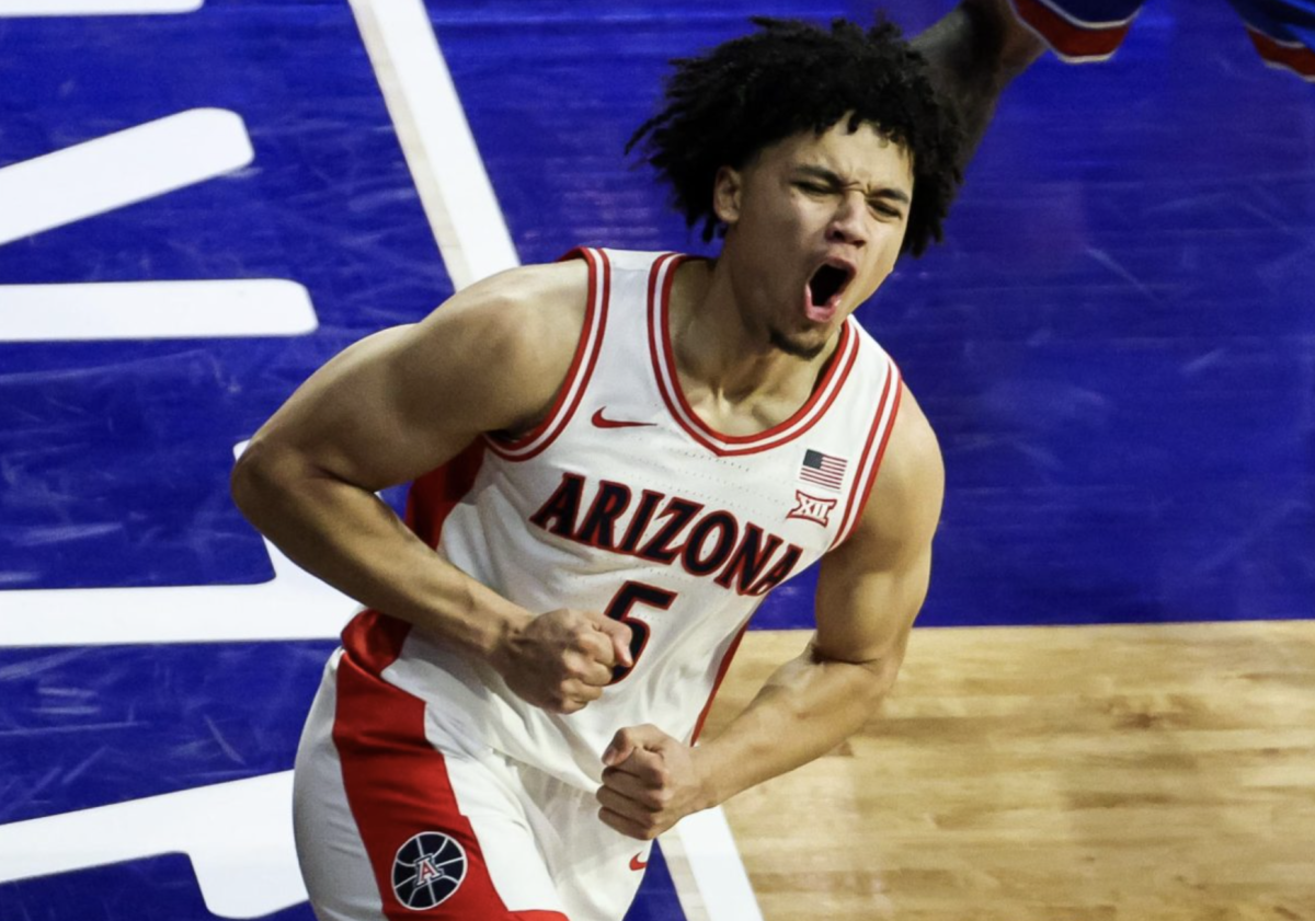 Brayden Burries celebrates after dunking the ball on a fast break in his revenge against Kansas (Source: The Daily Wildcat)