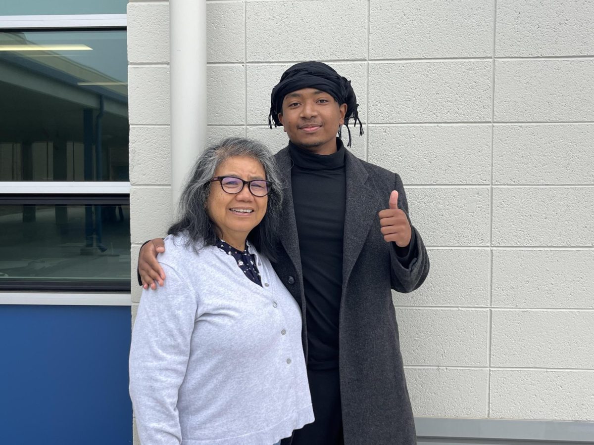 Mrs. Ricasata sharing a hug with one of her former students who came to visit. [Credit: Ms. Ricasata]