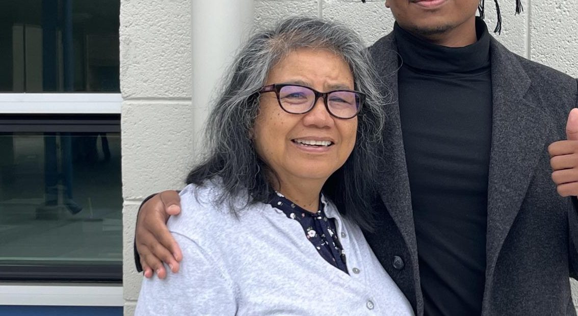 Mrs. Ricasata sharing a hug with one of her former students who came to visit. [Credit: Ms. Ricasata]