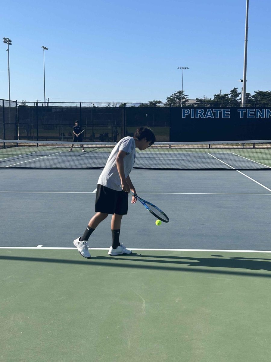 Boys Tennis team members practicing. 
