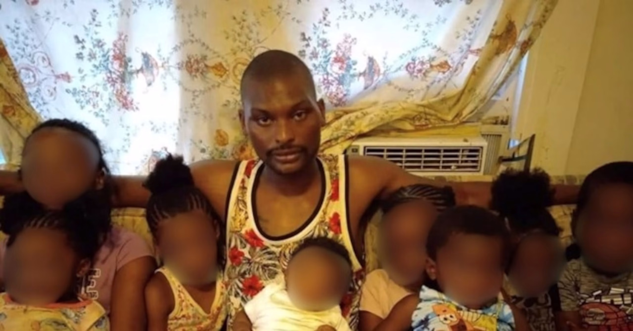 Elkins sits with his children just months before the incident (NPR)