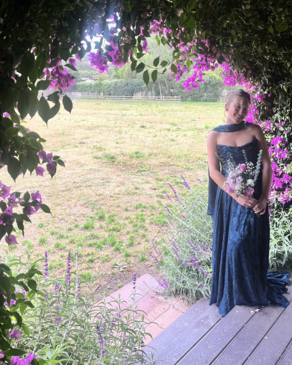 Lucy Duprey's prom dress shining in a dark turquoise. (Photo Credit: Lexi Denzel)